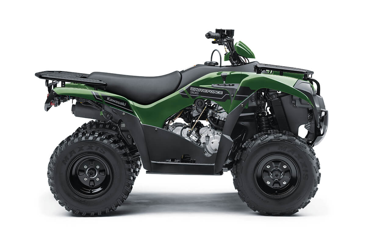 Profile angle of a green ATV staged in a white studio background.