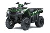 Three-quarter front angle of a green ATV staged in a white studio background.