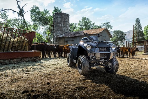 Three-quarter front angle of an ATV parked off-road. opens in a new window