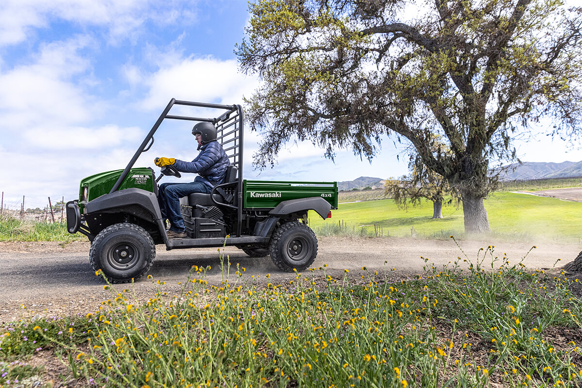 Side angle of a person driving a side x side off-road.