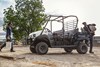 Side angle of a side x side parked off-road.
