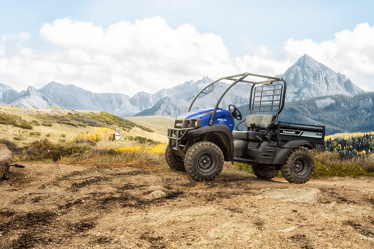 Three-quarter front angle of a side x side parked off-road.