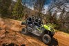Side angle of a person driving a side x side off-road.
