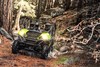 Front angle of a person driving a side x side off-road.
