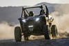Front angle of a side x side driving off-road.