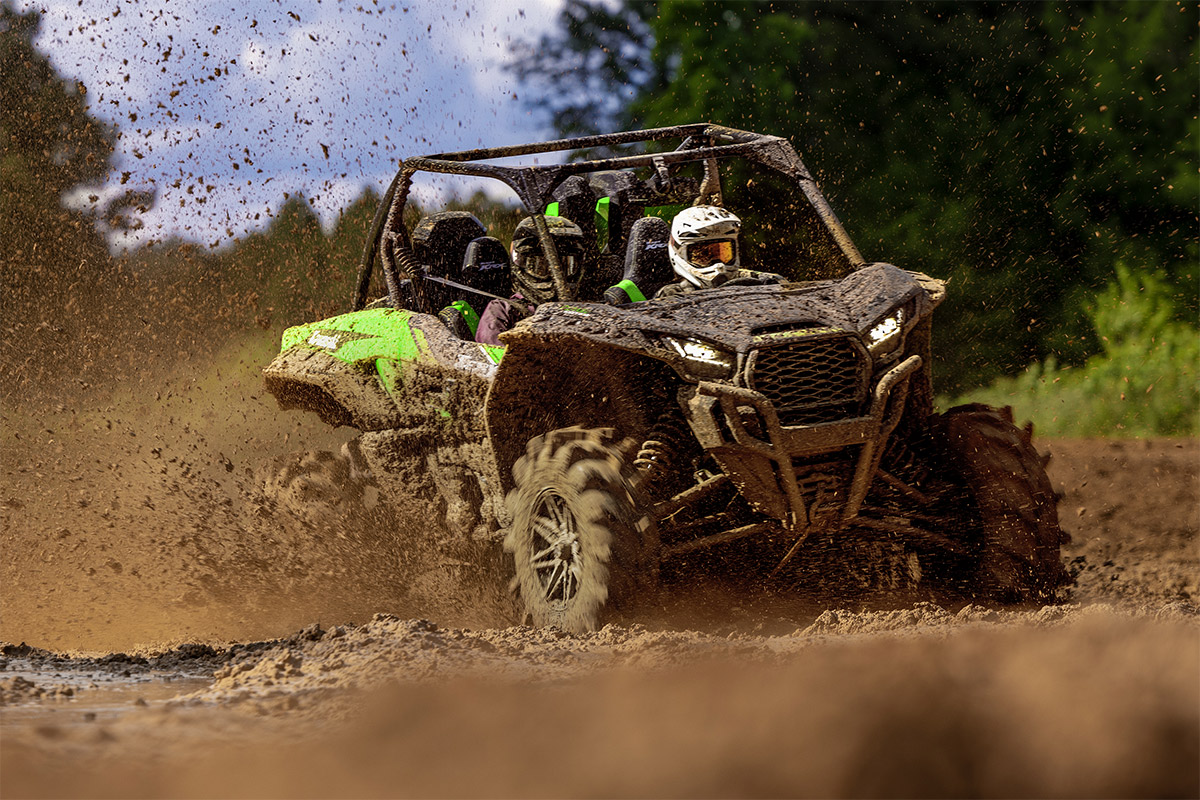 Three-quarter front angle of a person sliding a side x side off-road.