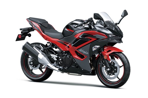 Three-quarter front angle of a red motorcycle staged in a white studio background. opens in a new window
