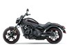 Profile angle of a motorcycle staged in a white studio background.