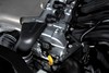 Detail view of the head of a four-cylinder side x side engine.