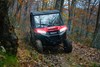 Front view of a person driving a side x side off-road.