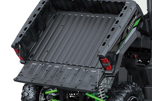 Front angle of the raised cargo bed of a side x side staged in a white studio background. opens in a new window