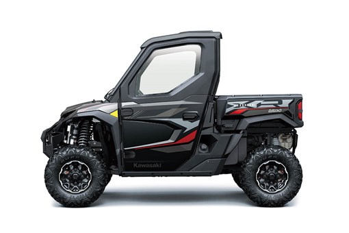 Left side view of a red and black side x side staged in a white studio background. opens in a new window