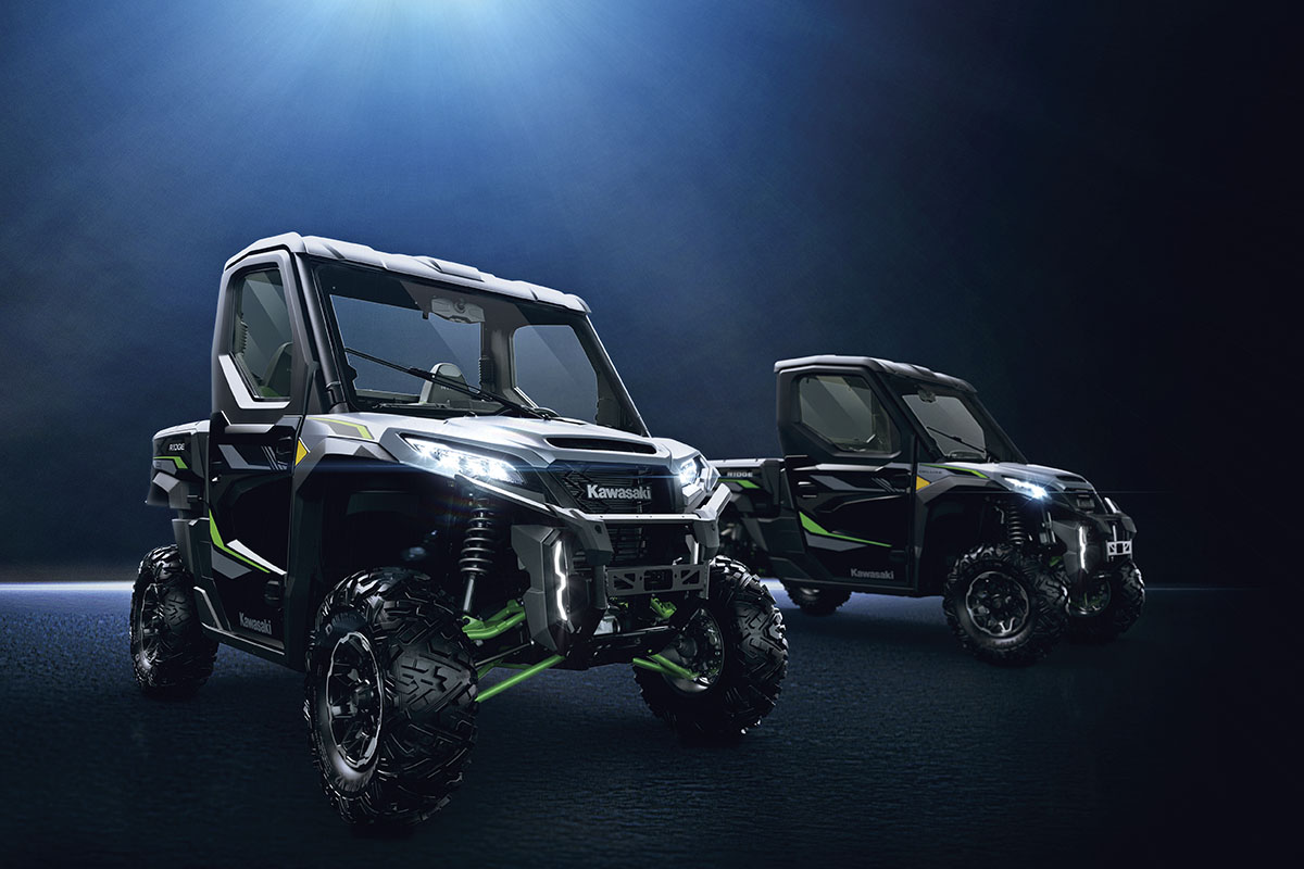 Three-quarter front angle of two side x sides staged in a blue studio background.