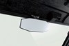 Close-up view of the rearview mirror of a side x side staged in a white studio background.