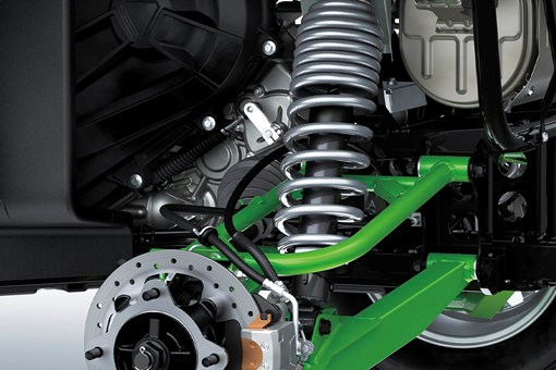 Close-up view of the shock and A-arm of a side x side staged in a white studio background. opens in a new window