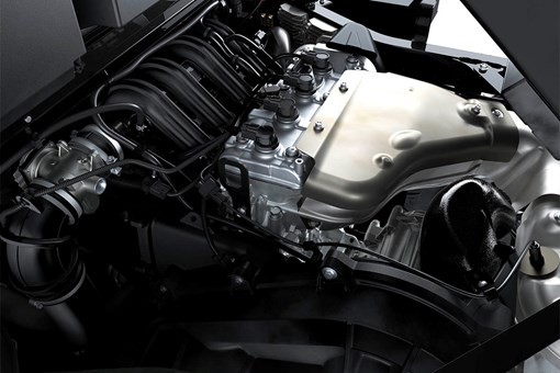 Top-down view of a side x side engine from inside the engine compartment. opens in a new window