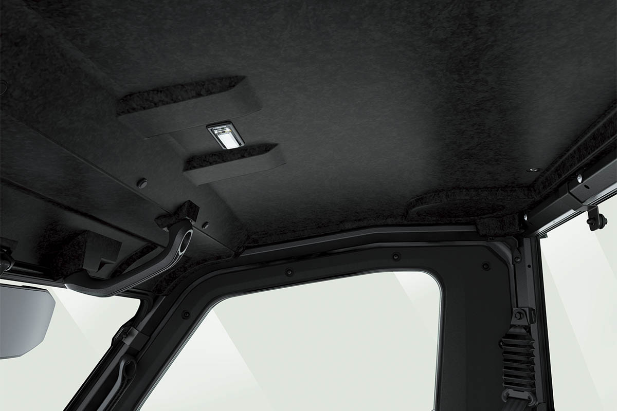 Close-up interior view of the ceiling of a side x side staged in a white studio background.