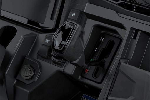 Close-up view of the gear shifter of a side x side. opens in a new window