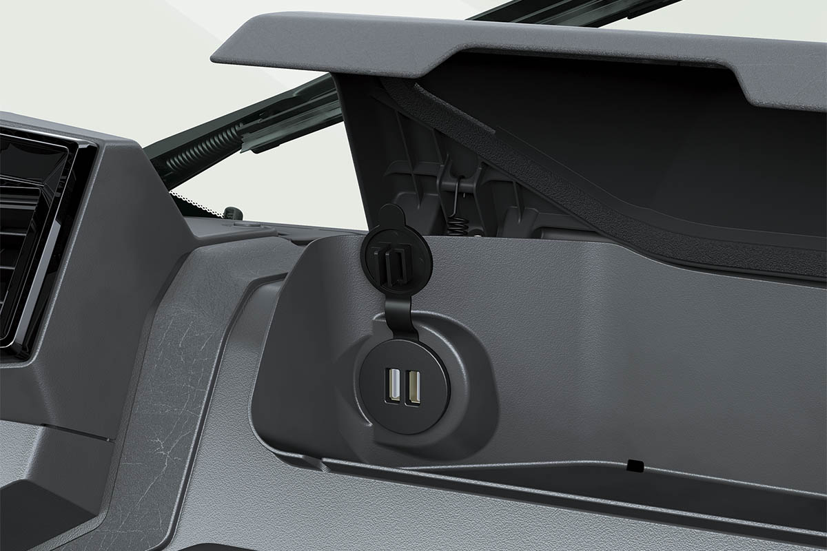 Close-up view of an electrical outlet in a side x side staged in a white studio background.