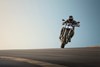 Front angle of a person riding a motorcycle on a track.