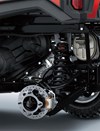 Detail view of rear right suspension system and brake rotor of a side x side.