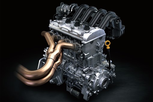 Three-quarter front view of a four-cylinder side x side engine. opens in a new window