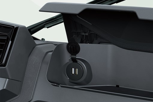Interior view of dual USB-C ports inside the dashboard storage compartment of a side x side. opens in a new window
