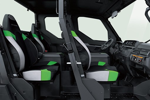 Profile view of interior of a side x side showing passenger seating in white studio background. opens in a new window
