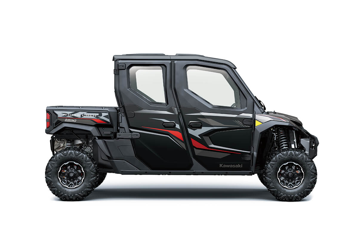 Right side view of a black and red side x side staged in a white studio background. 