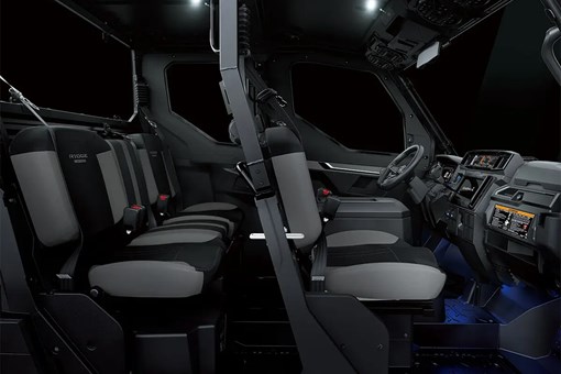 Profile view of interior of a side x side showing passenger seating in dark studio background. opens in a new window