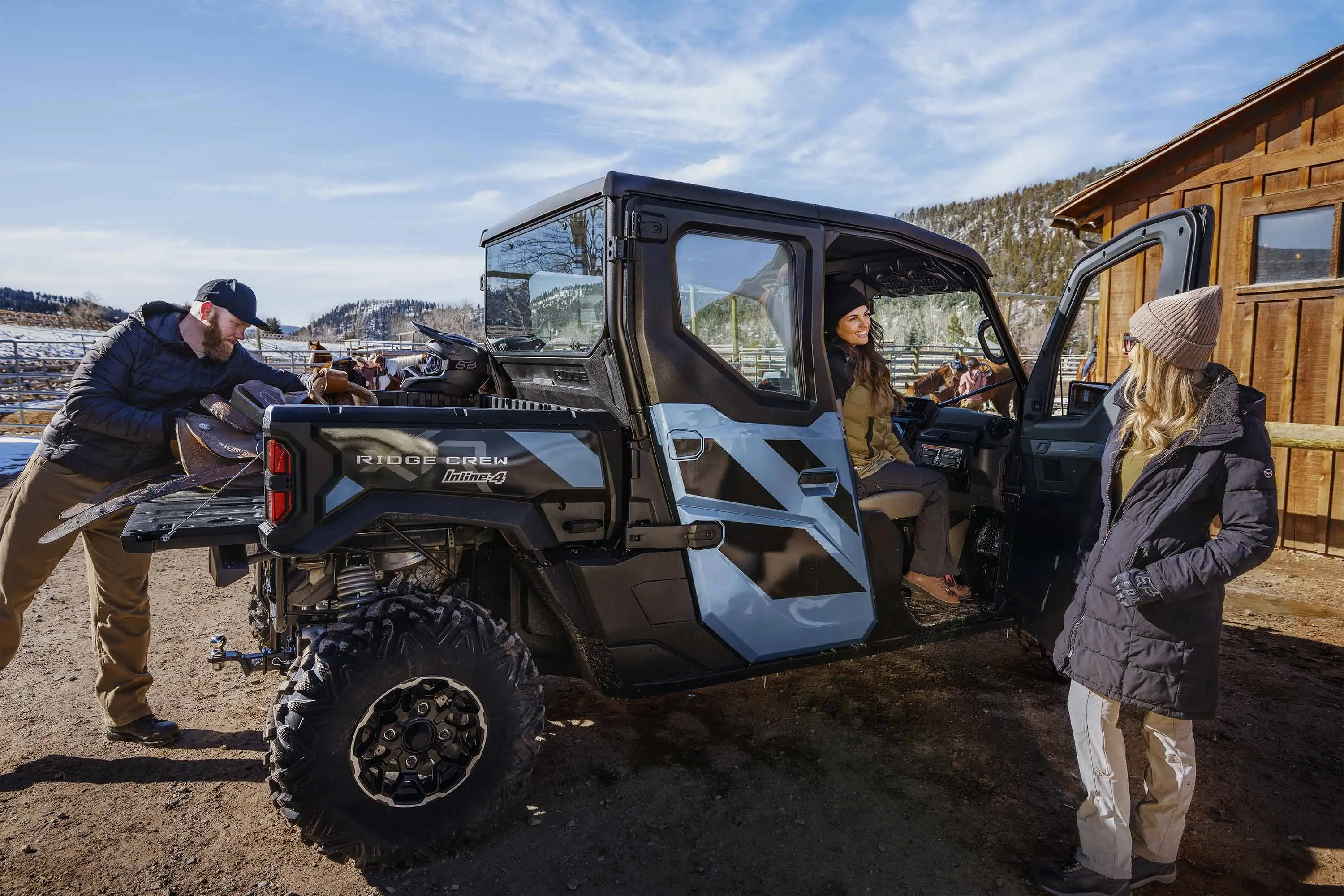 Side angle of two people loading a side x side.