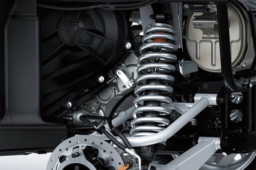 Detail view of rear right suspension system and brake rotor of a side x side. opens in a new window