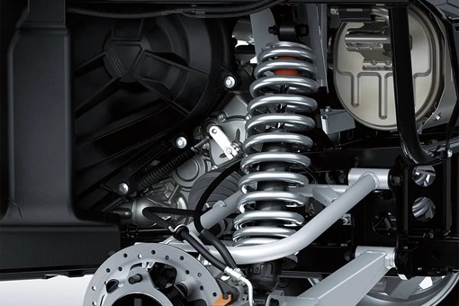 Detail view of rear right suspension system and brake rotor of a side x side. opens in a new window