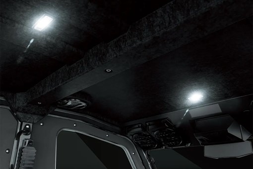 Interior view of overhead interior cabin lighting of a side x side. opens in a new window