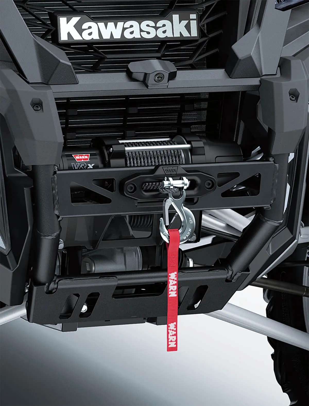 Detail view of the front bumper and winch of a side x side.