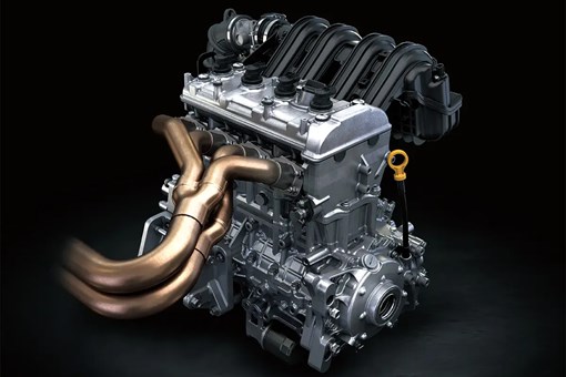 Three-quarter front view of a four-cylinder side x side engine. opens in a new window