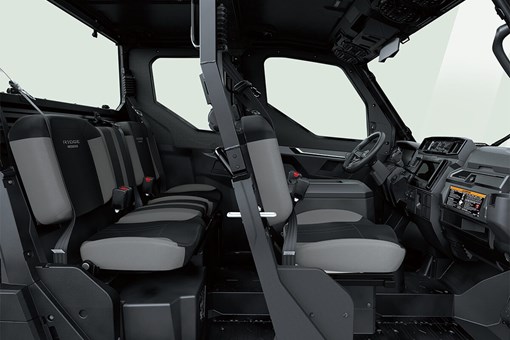 Profile view of interior of a side x side showing passenger seating in white studio background. opens in a new window