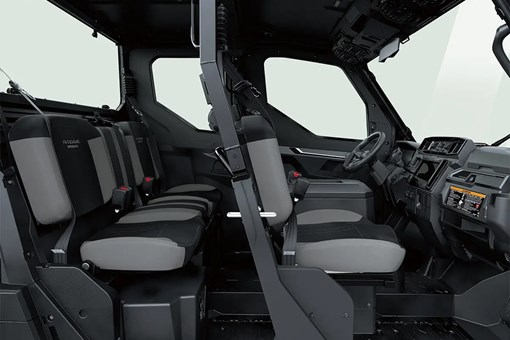 Profile view of interior of a side x side showing passenger seating in white studio background. opens in a new window