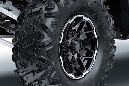 Detail view of the front right wheel and tire of a side x side. opens in a new window