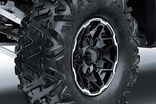 Detail view of the front right wheel and tire of a side x side. opens in a new window
