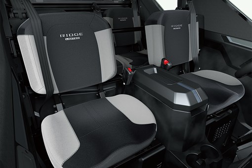 Interior view of front seating inside a side x side with center console. opens in a new window