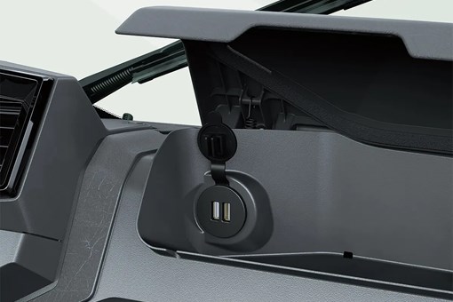 Interior view of dual USB-C ports inside the dashboard storage compartment of a side x side. opens in a new window