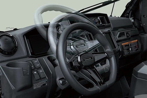 Interior angle view showing adjustability of the steering wheel of a side x side. opens in a new window