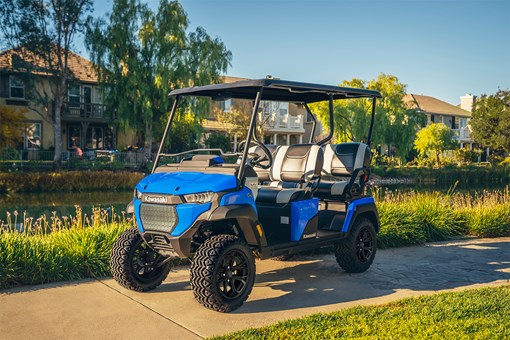 Three-quarter front angle of Neighborhood Activity Vehicle staged on a driveable sidewalk. opens in a new window