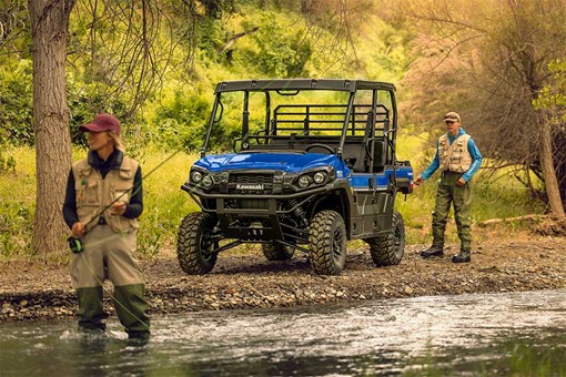 Three-quarter front angle of a side x side parked off-road. opens in a new window
