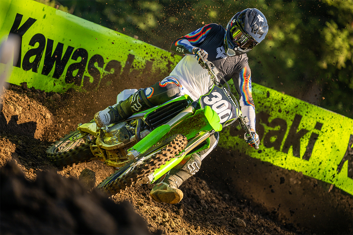 Front angle of a person riding a motorcycle on a dirt track.