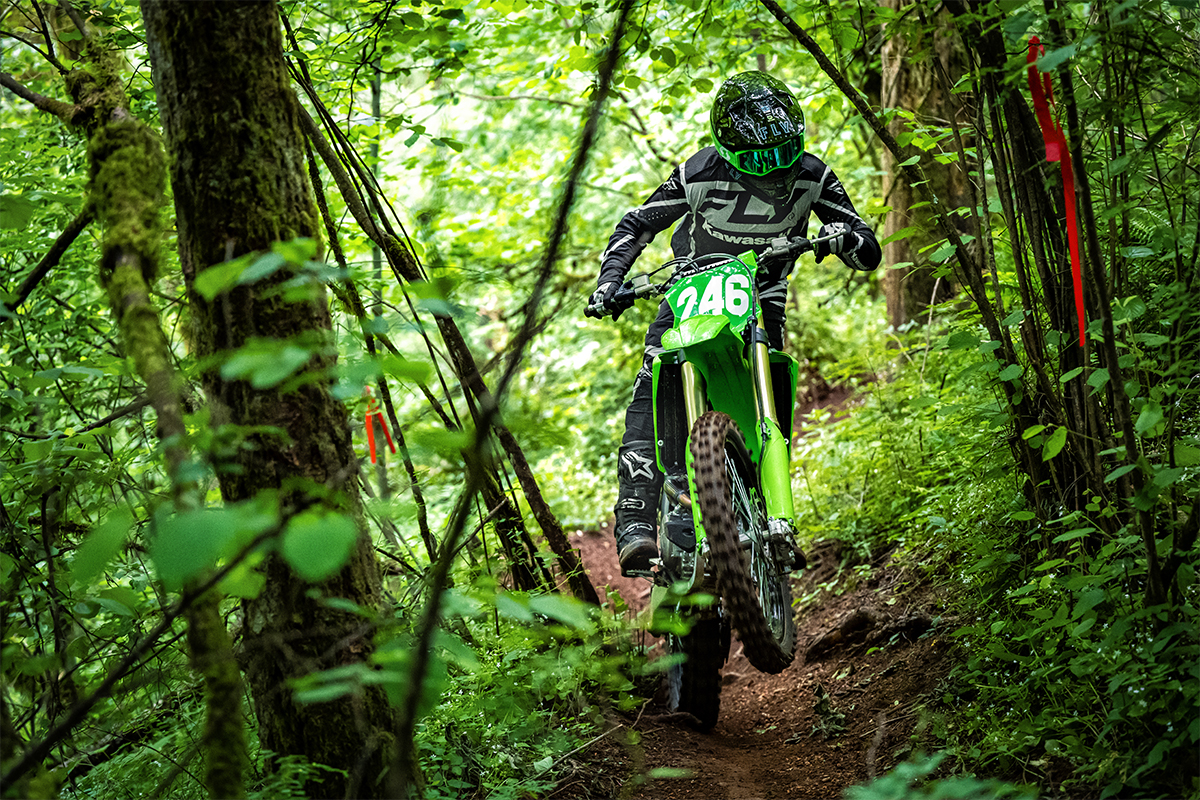 Front angle of a person riding a motorcycle on an off-road course.