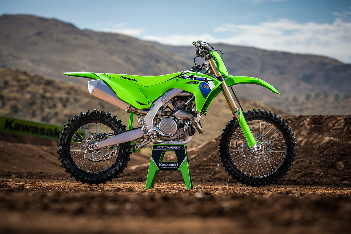 Side angle of a motorcycle staged on a dirt track.