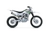 Profile angle of a silver motorcycle staged in a white studio background.