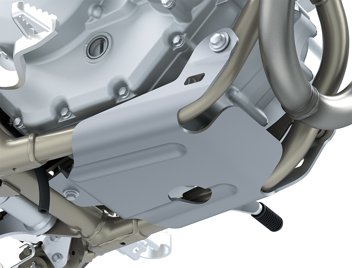 Close-up view of the skid plate of a motorcycle staged in a white studio background.